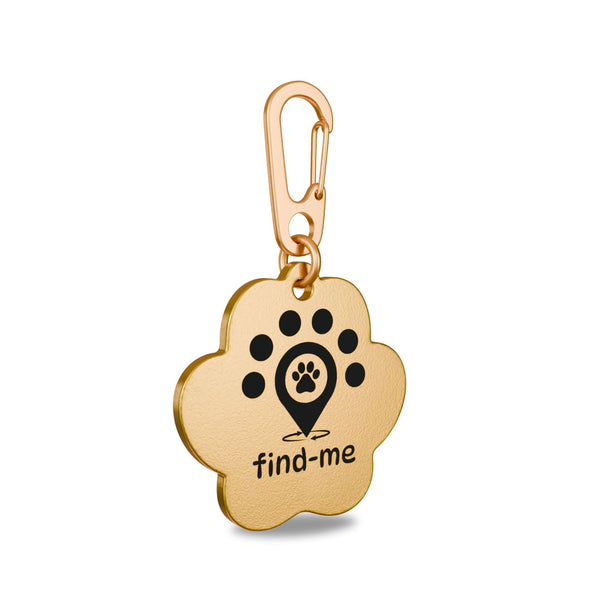 “31.85mm x 31.20mm paw shapped brass Find Me pet ID tag engraved with the Find Me logo: a location pin with a paw print symbolizing a pet found quickly, surrounded by five dots representing the Find Me community, and circular arrows indicating a safe, fast reunion. Attached to a matching brass Ezee clip and brass split ring to prevent corrosion.”